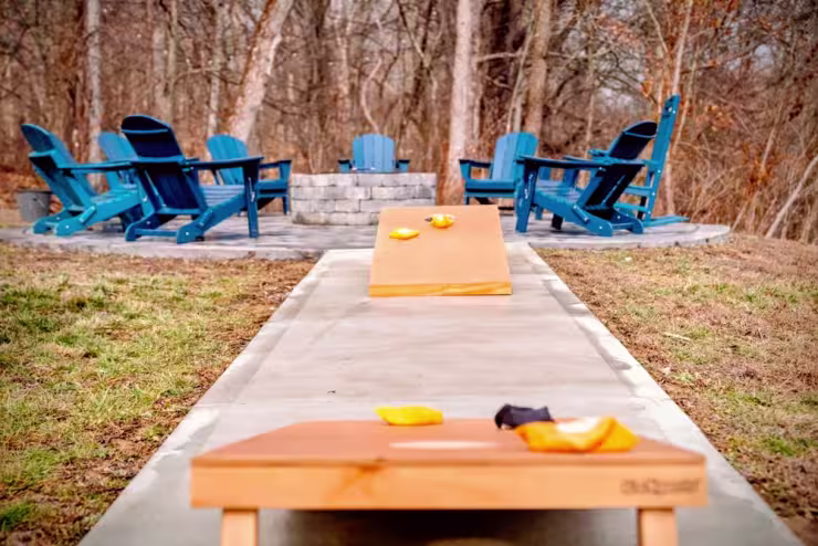 Cornhole by the fire pit at Pool House Lodge